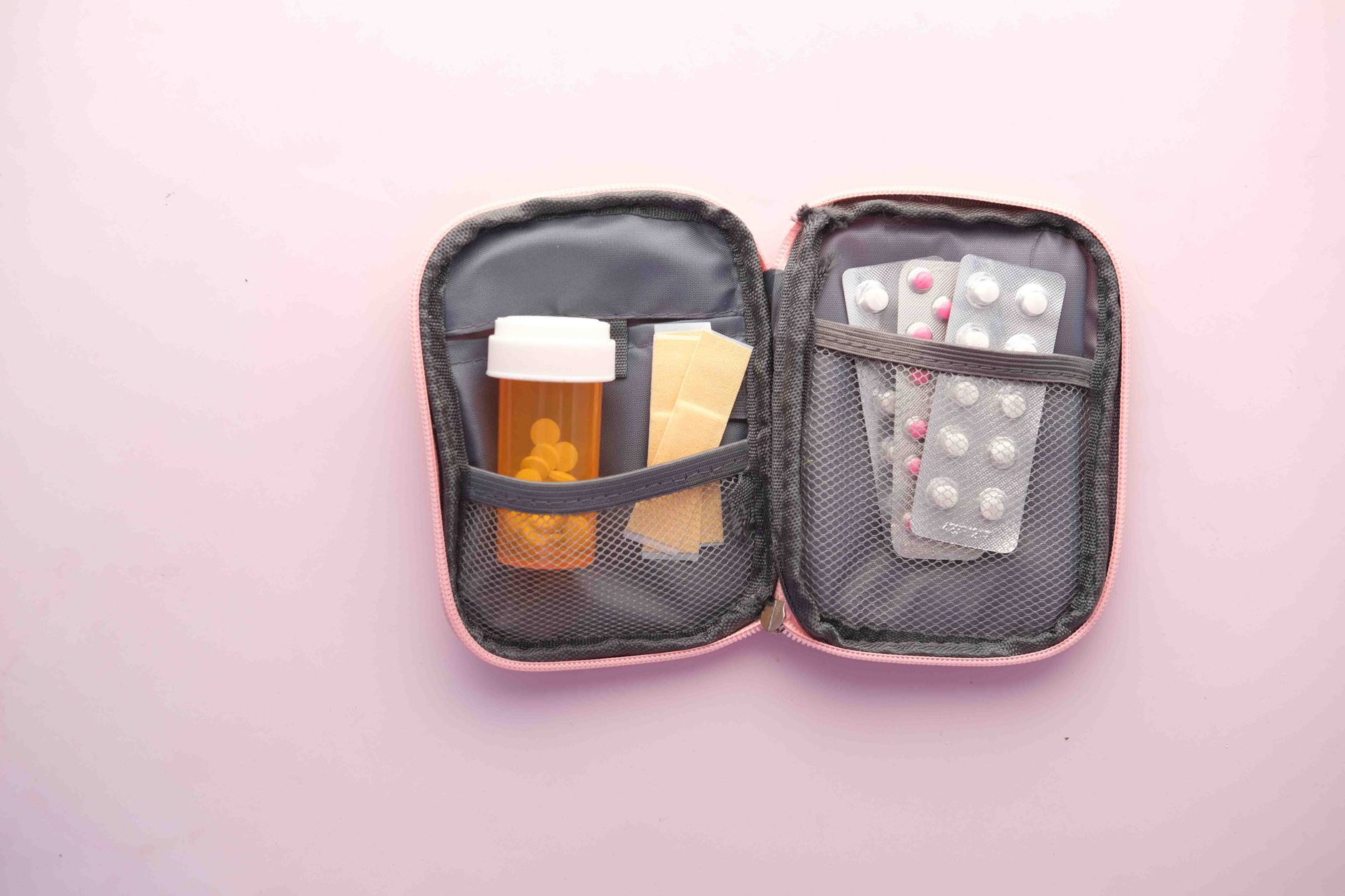 first aid kit with medicines and pills